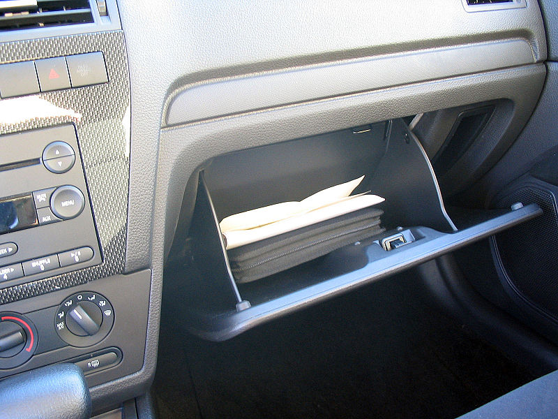 image of car owners manual in glove compartment